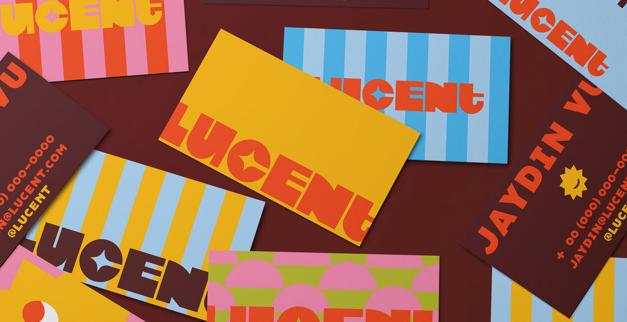 Assorted Lucent Sun business cards arranged on a surface, showcasing vibrant color palettes, geometric patterns, bold typography, and playful brand elements.