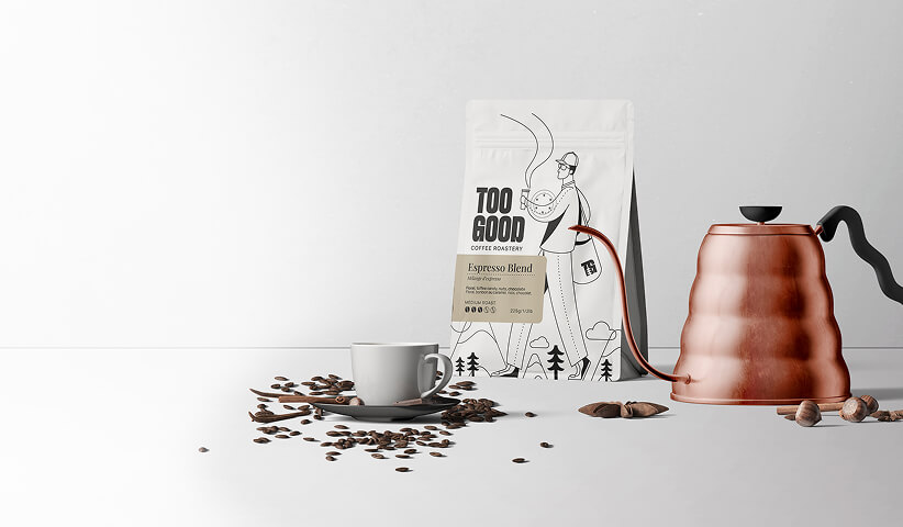 Branded coffee packaging displayed alongside brewing equipment and coffee beans, demonstrating packaging design that enhances storytelling and product positioning.