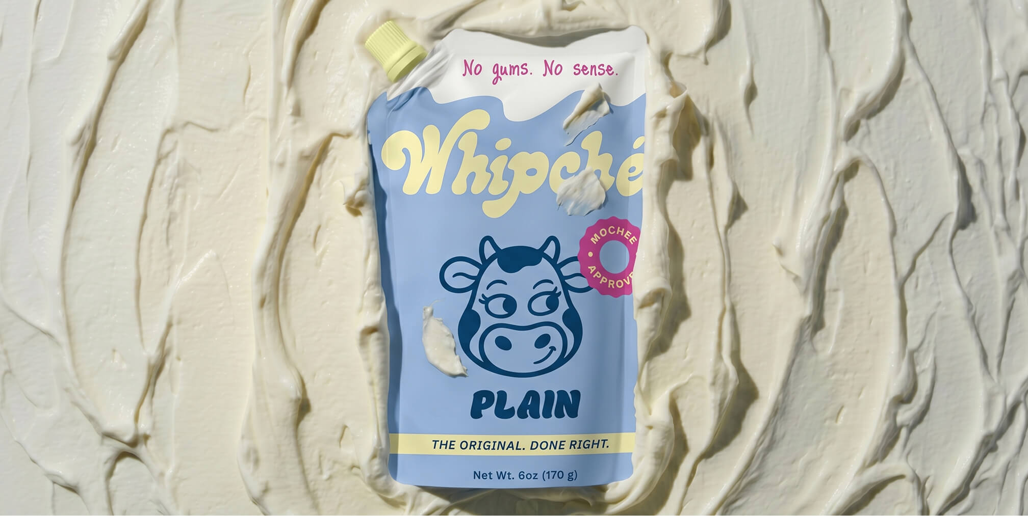 Playful yogurt pouch packaging displayed against a textured cream background, illustrating how distinctive packaging design helps products stand out and connect with consumers.