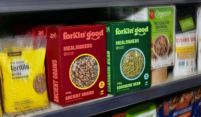Forkin’ Good packaged products displayed in a grocery store aisle, demonstrating packaging design that helps products stand out in competitive retail environments.
