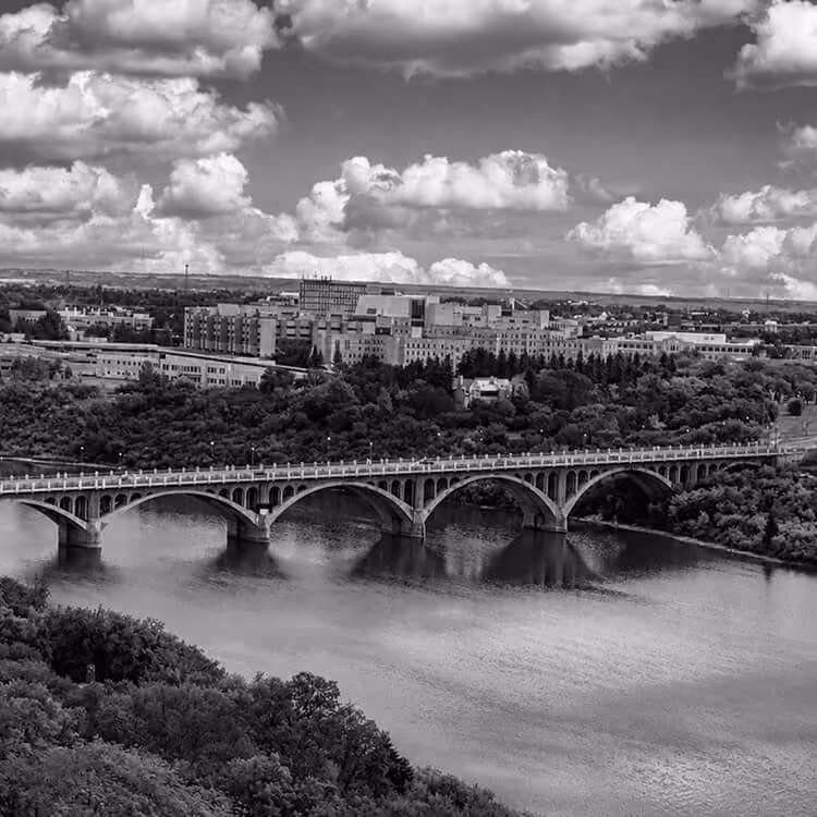 Broadway Bridge spanning the South Saskatchewan River with Saskatoon’s skyline in the background.