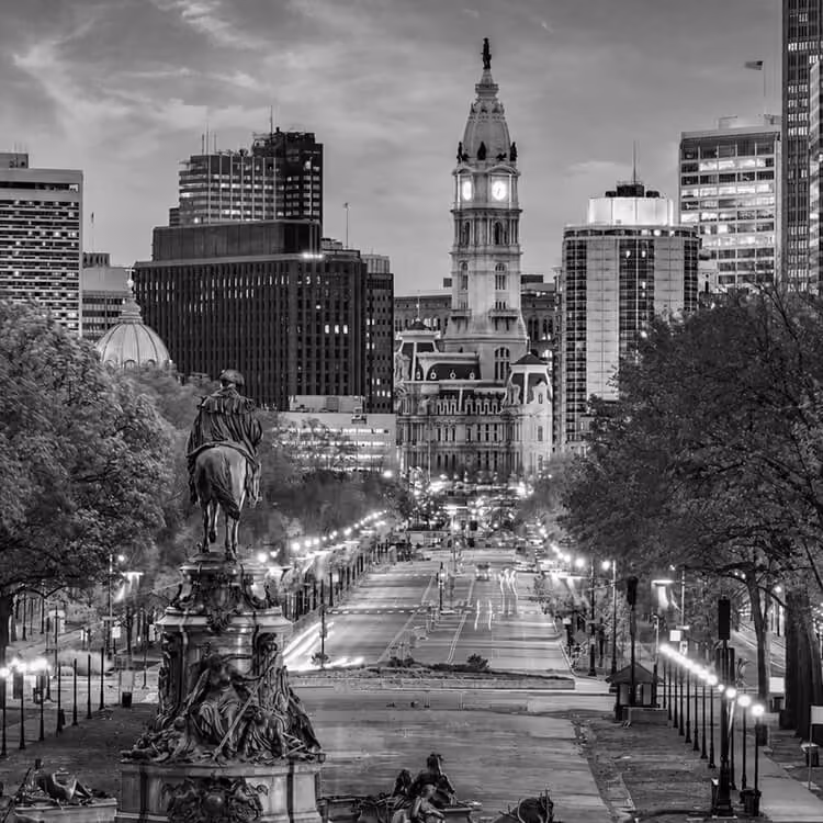 Philadelphia City Hall viewed from Benjamin Franklin Parkway at dusk.