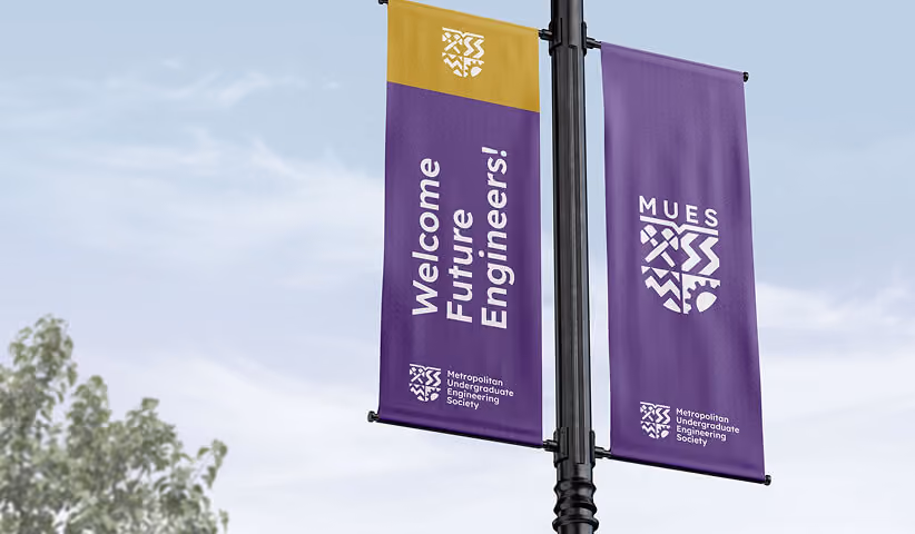 Branded street banners displaying a consistent visual identity across urban environments, demonstrating how corporate graphics extend brand visibility through public wayfinding and environmental design.