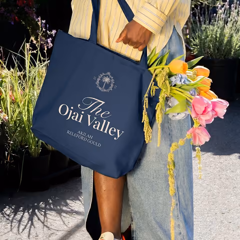 Ojai Valley branded tote bag with flowers.