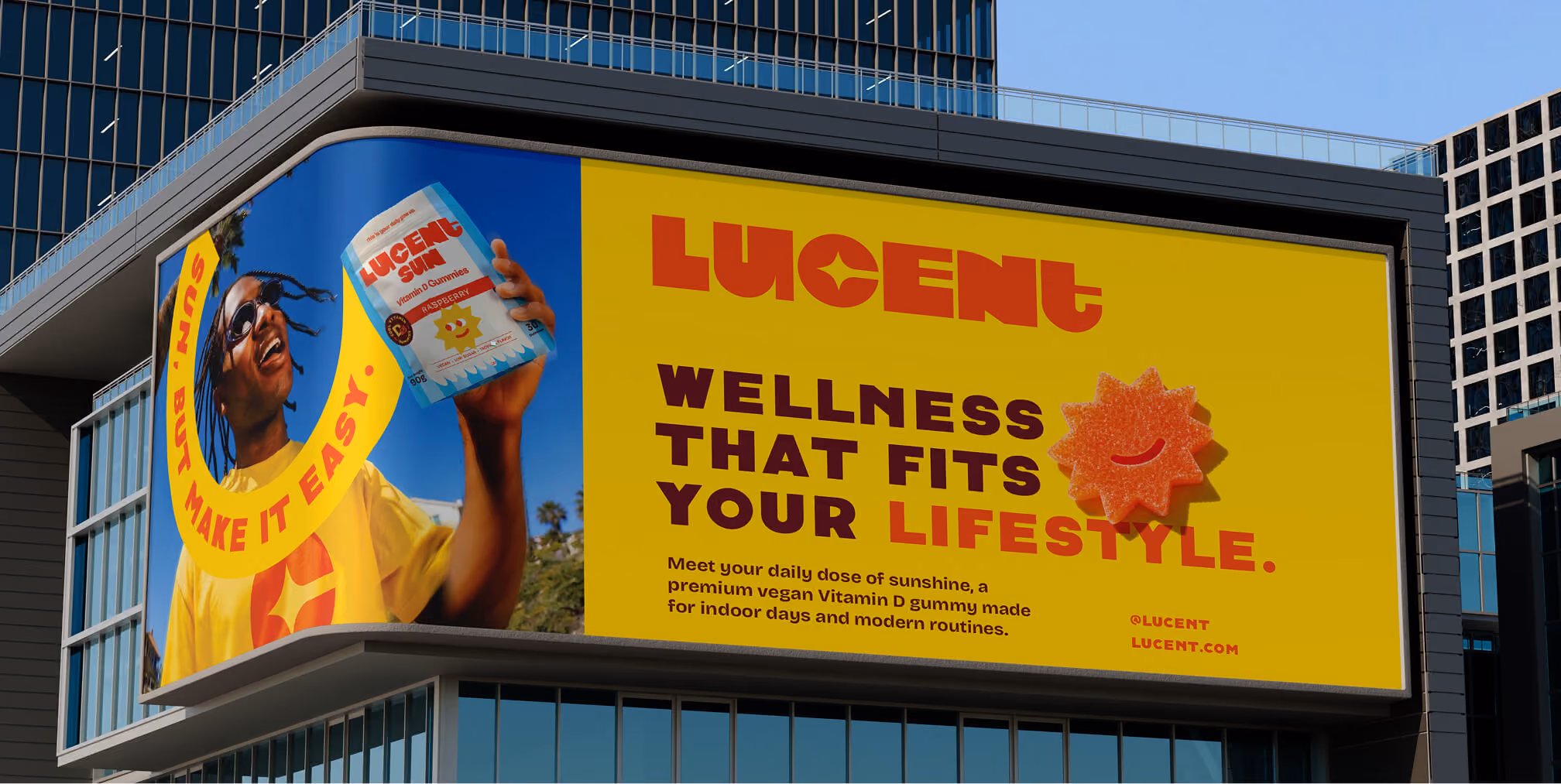 Large outdoor billboard advertising a vitamin gummy supplement brand with bold lifestyle-focused messaging.