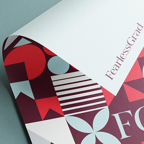Premium FearlessGrad branded folder featuring geometric graphic design and custom stationery elements that reinforce a cohesive brand identity.