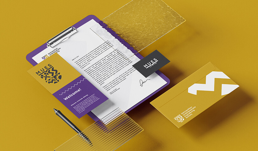 University stationery design package with branded folder, business cards, letterhead, envelope, and office supplies for consistent institutional branding.