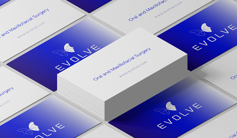 Evolve Oral and Maxillofacial Surgery business cards featuring premium healthcare branding and professional stationery design.