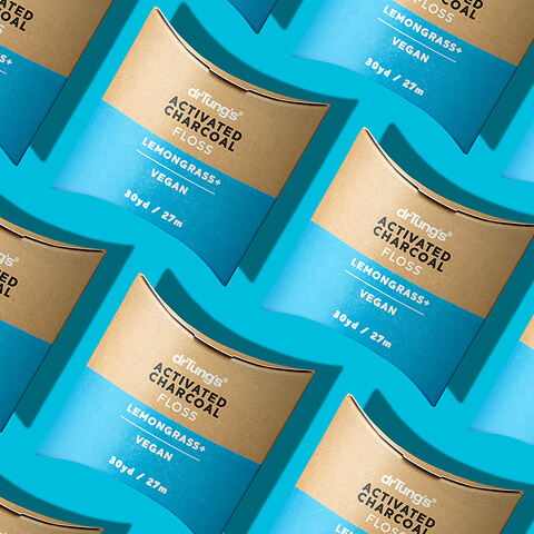 Pattern of DrTung's Activated Charcoal Floss packaging showcasing premium packaging design, product branding, and visual identity consistency.