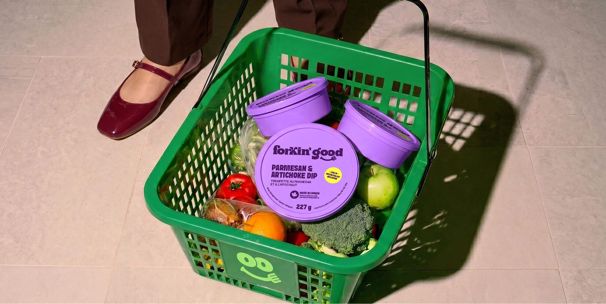 Grocery basket filled with Forkin' Good products and fresh ingredients, illustrating how consistent branding creates a memorable shopping experience and builds customer loyalty.