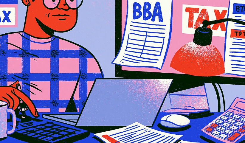 Small business owner working from a desk with tax forms, business licenses, financial documents, calculator, and laptop while managing ongoing compliance requirements.