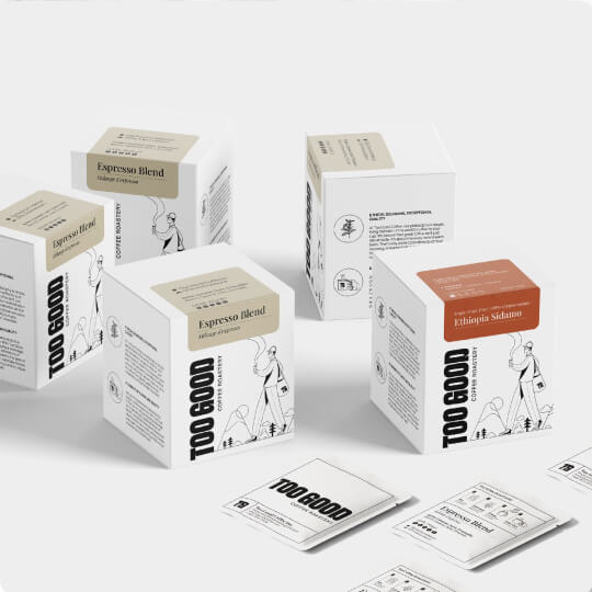 Minimalist coffee packaging design for TOO GOOD Coffee, showcasing branded retail boxes and specialty coffee labels.