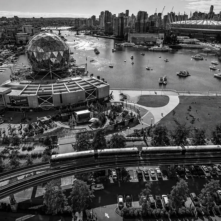 Aerial view of Vancouver’s False Creek and Science World with the SkyTrain crossing the waterfront near Richmond.