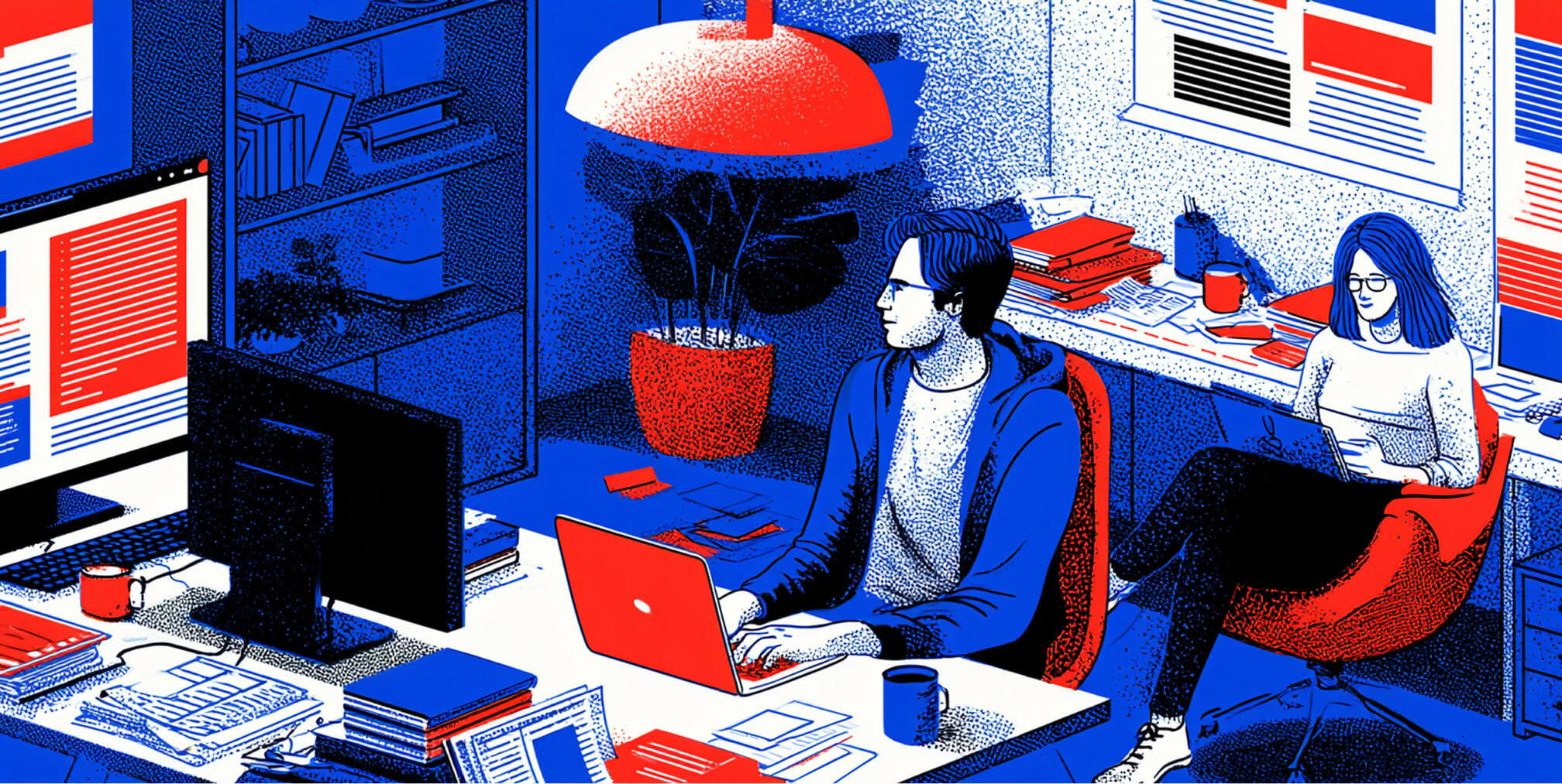 Designers working together in a content-focused studio surrounded by screens and layouts, representing collaborative branding, design, and digital execution.