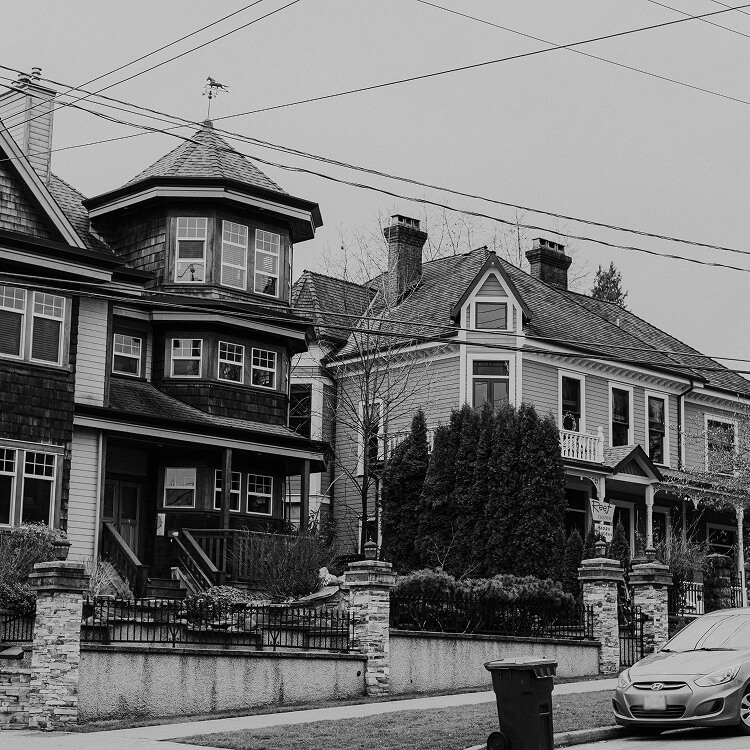 Heritage homes along a residential street in New Westminster, showcasing the city's historic architecture and established neighbourhood character.