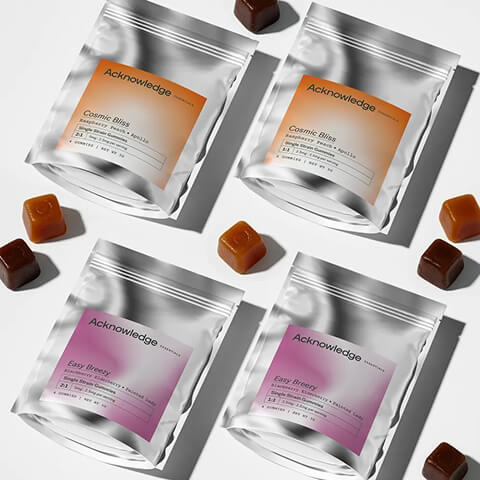 Acknowledge Cosmic Bliss and Easy Breezy gummy pouches arranged with individual gummies on a white background.