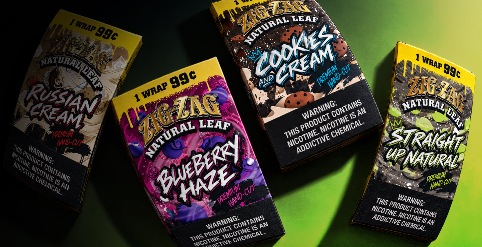 Zig-Zag Natural Leaf wrap packages in Russian Cream, Blueberry Haze, Cookies and Cream, and Straight Up Natural flavors arranged against a dramatic green and black background.