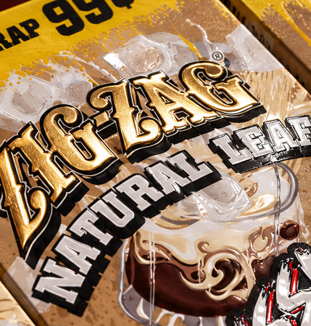 Detailed close-up of the metallic Zig-Zag Natural Leaf logo and Russian Cream package artwork featuring ice and creamy coffee graphics.