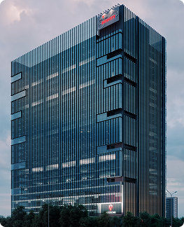 Tall modern office building with reflective glass windows and logos on top and bottom on a cloudy day.