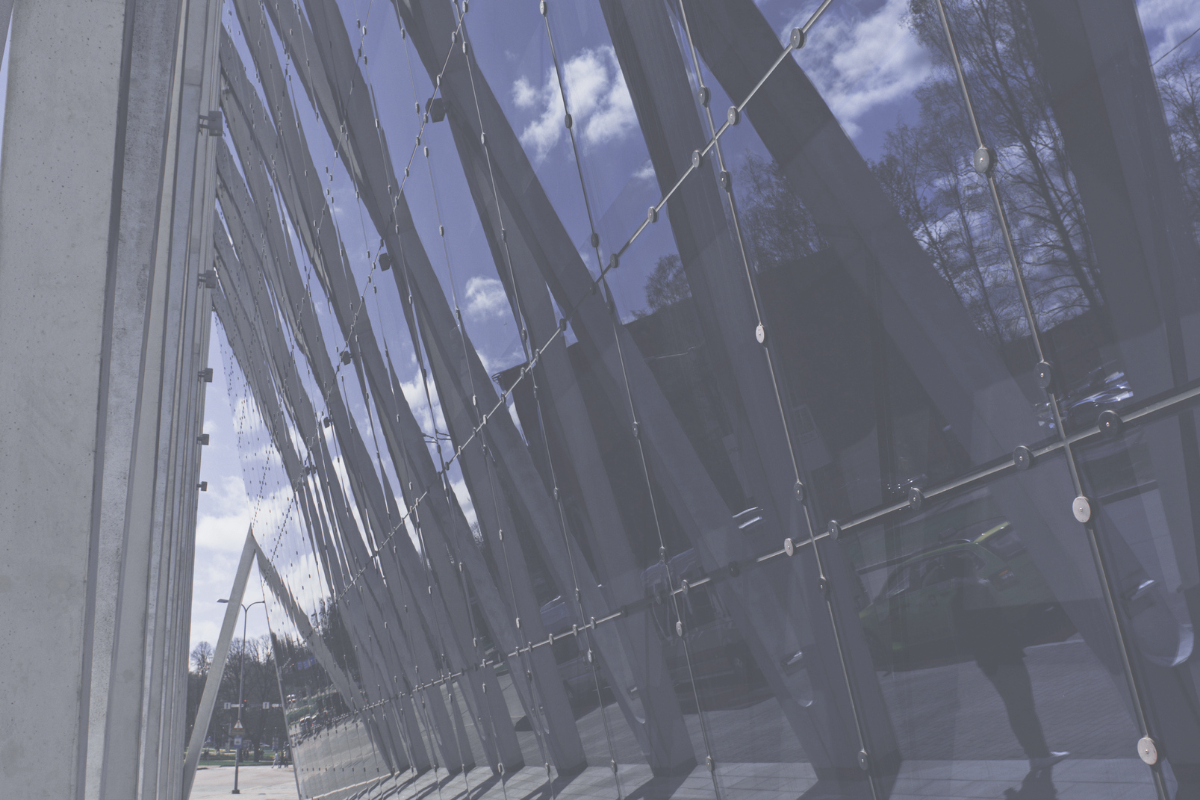 Angled glass wall with steel struts, representing the path to investing in a UAE mutual fund