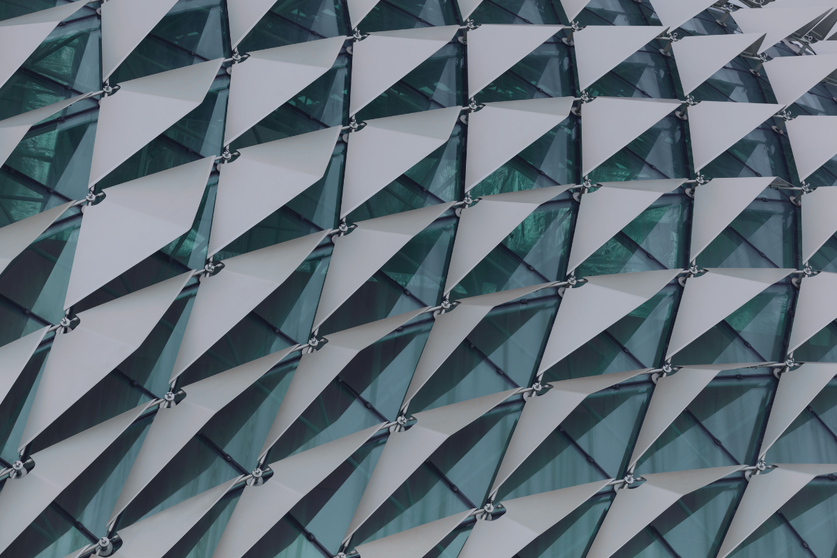 Facade of triangular shading panels, representing the connecting factors that trigger each tax