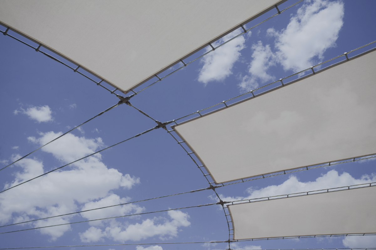 Fabric canopy panels against a blue sky, representing the limits of what a tax treaty covers