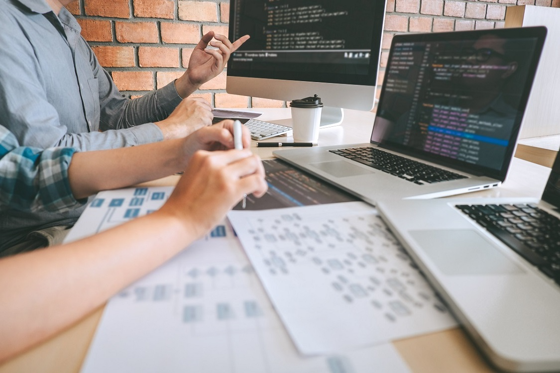 Developers working on AI-generated code