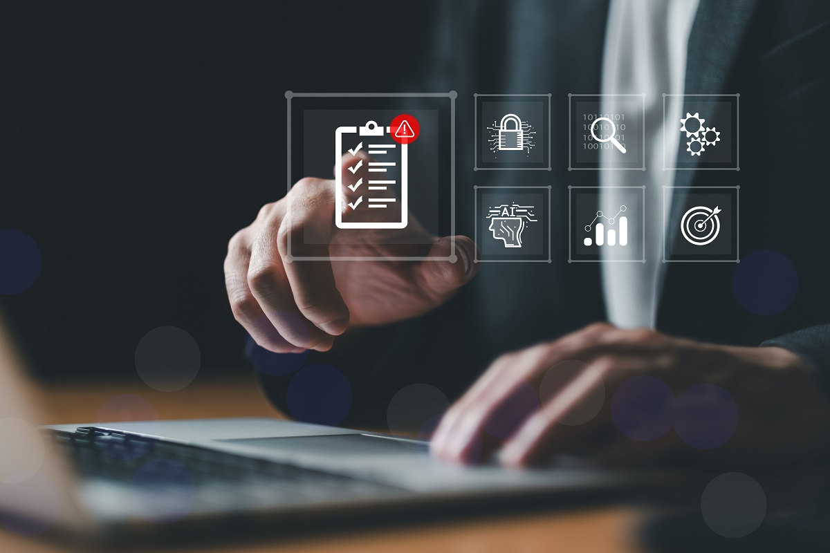 Business professional using a laptop with digital icons representing AI risk assessment, cybersecurity, data protection, and compliance management