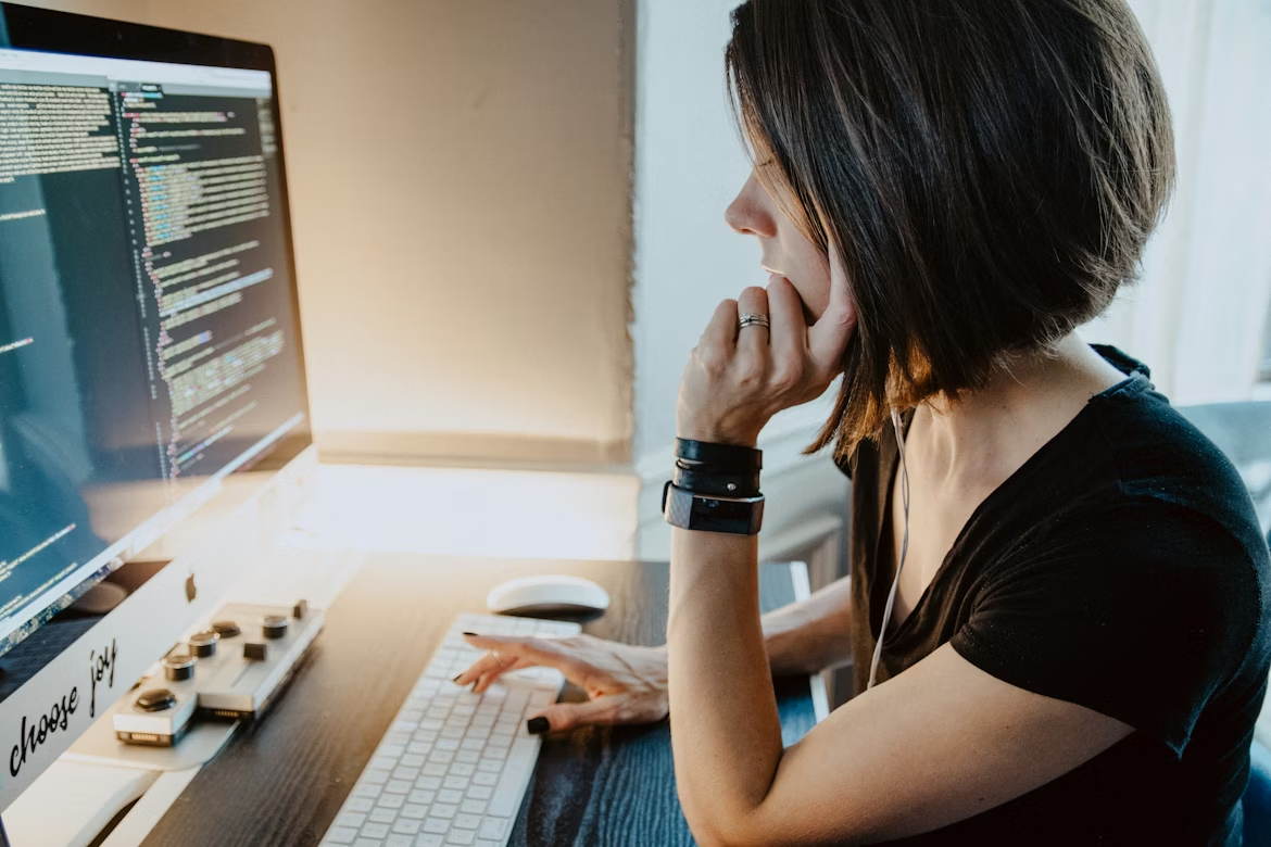Engineer analyzing AI model behavior to detect data poisoning in machine learning and improve model security