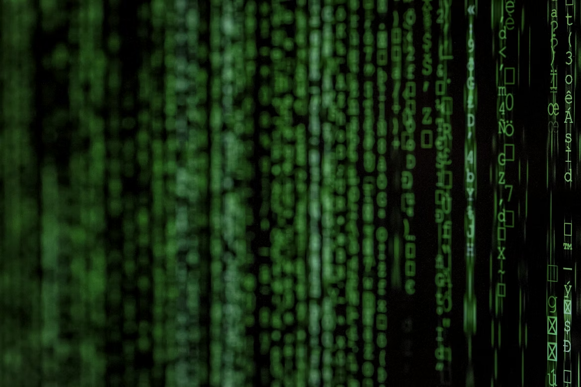 Green code stream representing data poisoning and malicious code entering AI and LLM systems