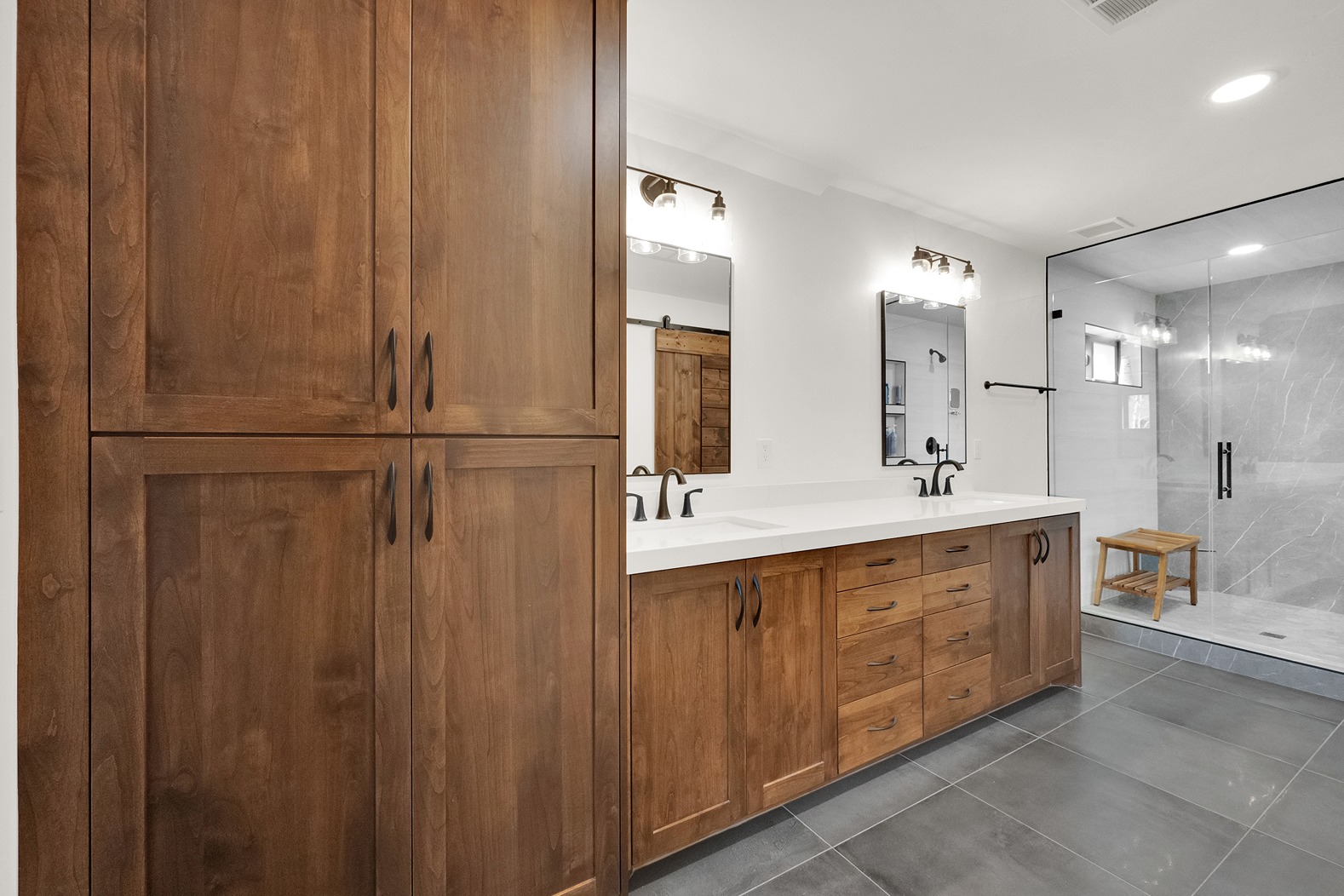 Large natural stone flooring near furniture style cabinetry in Salt Lake City