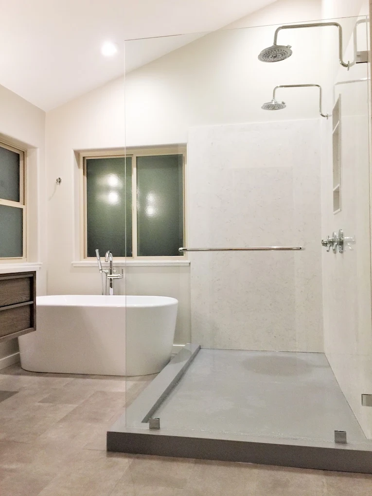 Frameless walk-in shower with heated natural stone floor in Salt Lake City