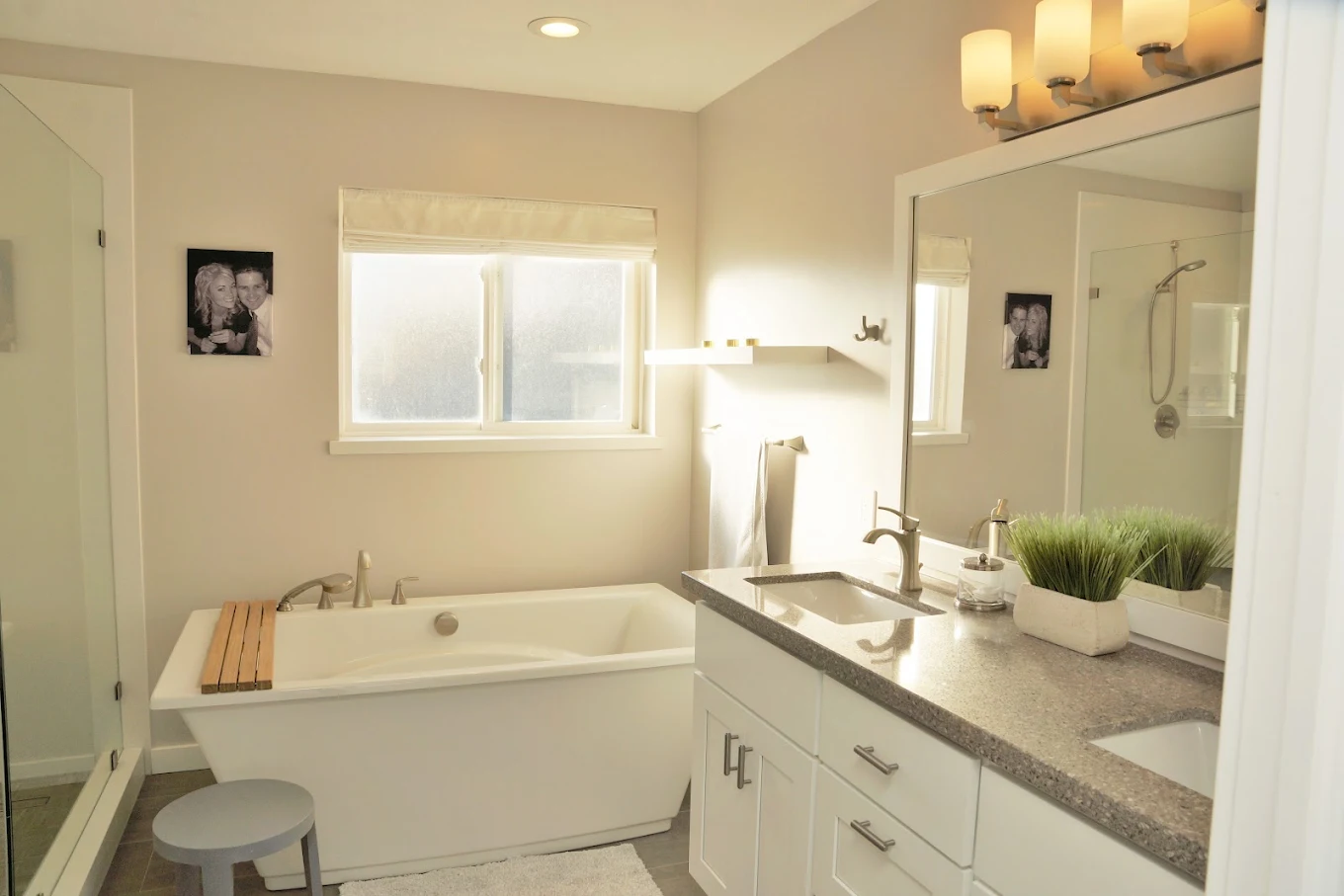Finished bathroom with freestanding tub and natural stone floor