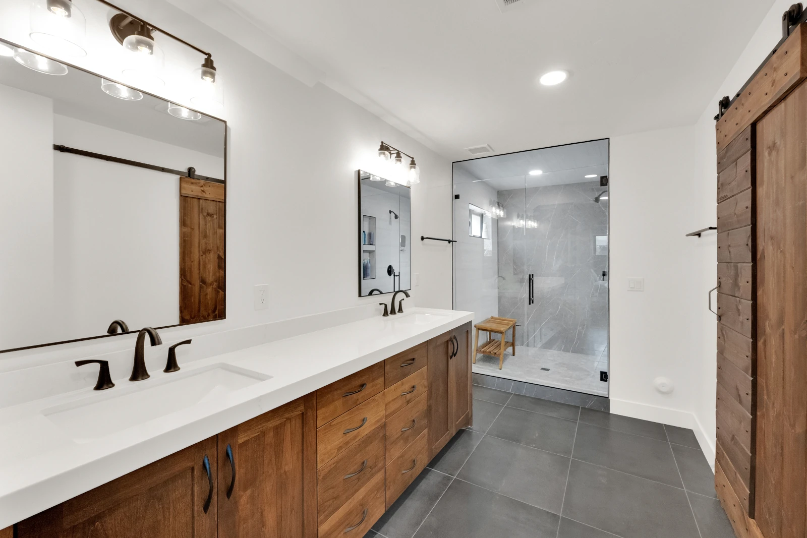 Walk-in shower with large natural stone tiles in Salt Lake City