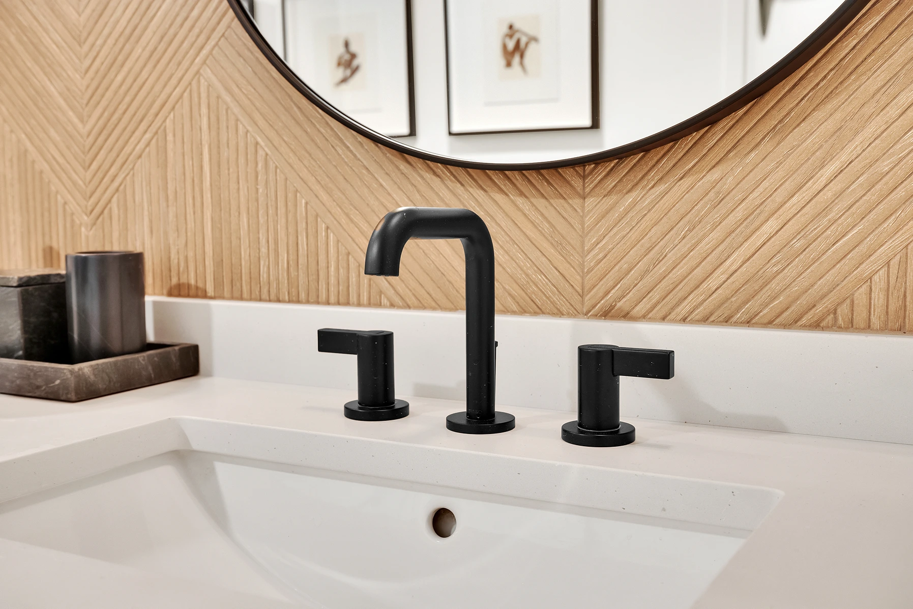 Newly installed faucet in a sink near a vanity mirror in a Salt Lake City bathroom