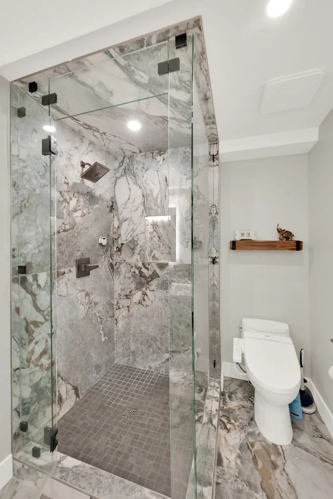 Walk-in shower with marble-look tile and curbless entry in Salt Lake City
