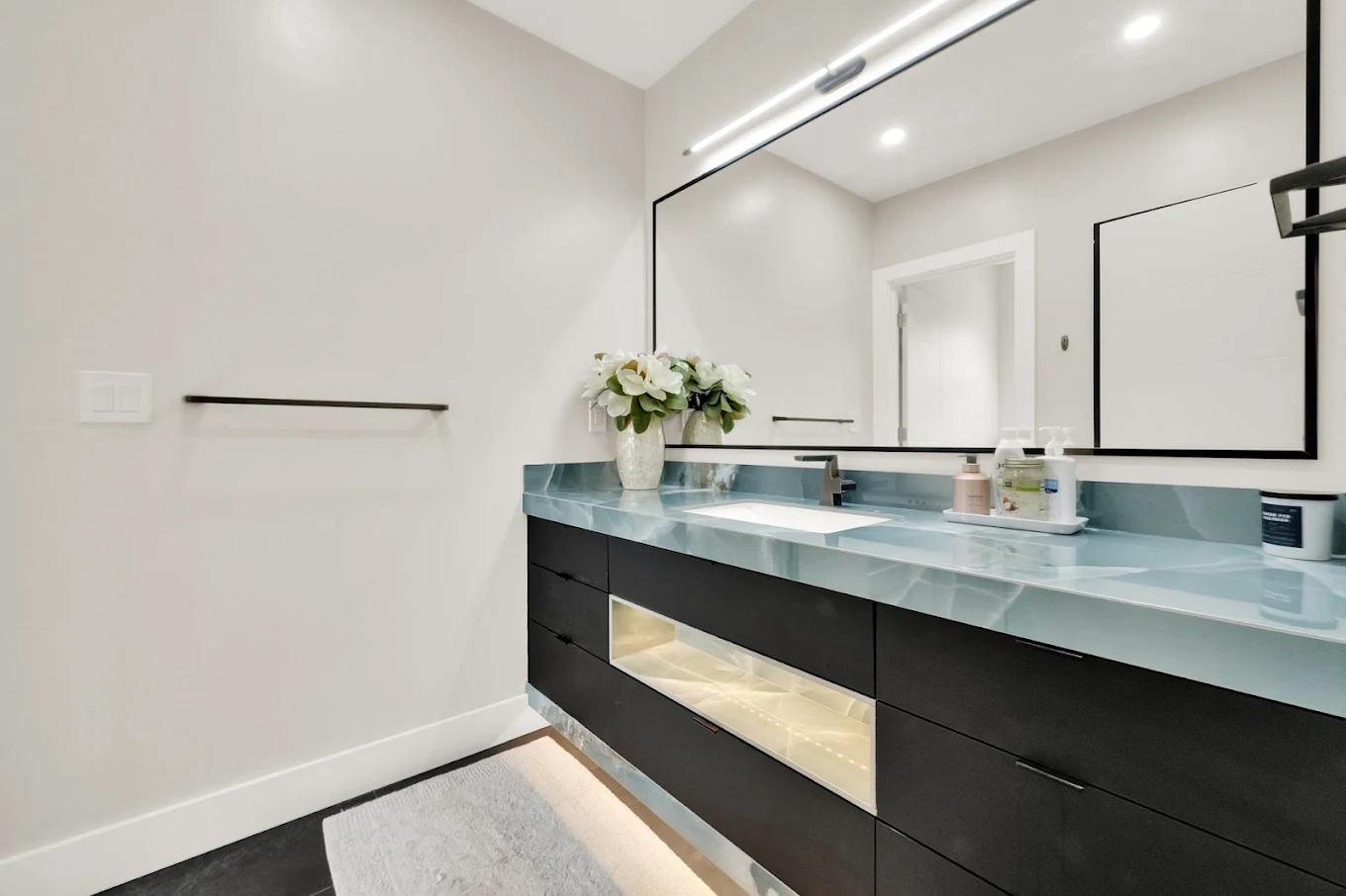 Large natural stone flooring near furniture style cabinetry in Salt Lake City