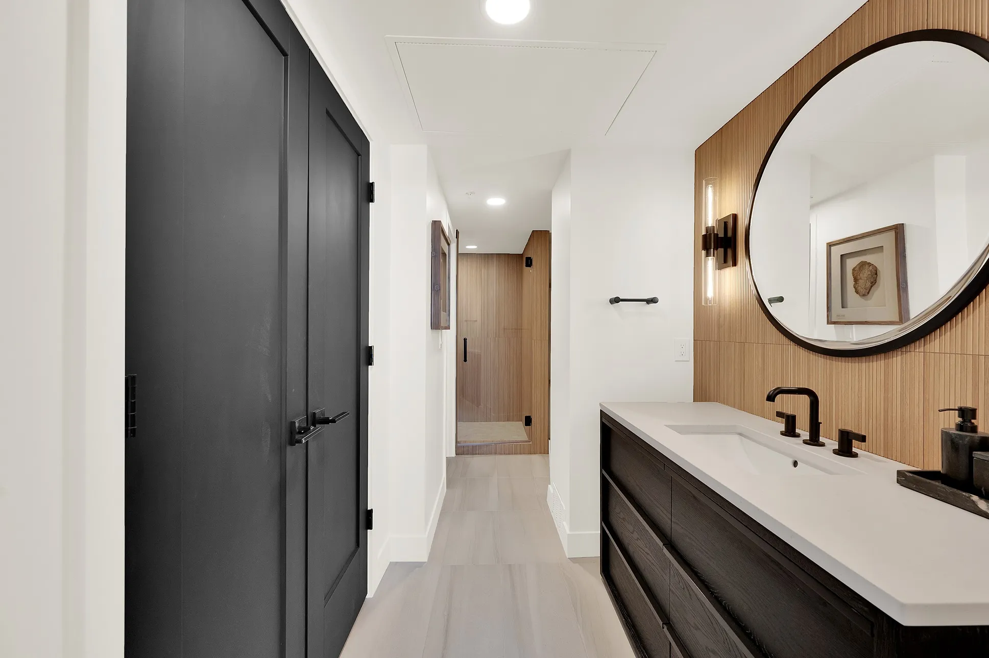 Guest bathroom vanity with integrated storage in a Salt Lake City home