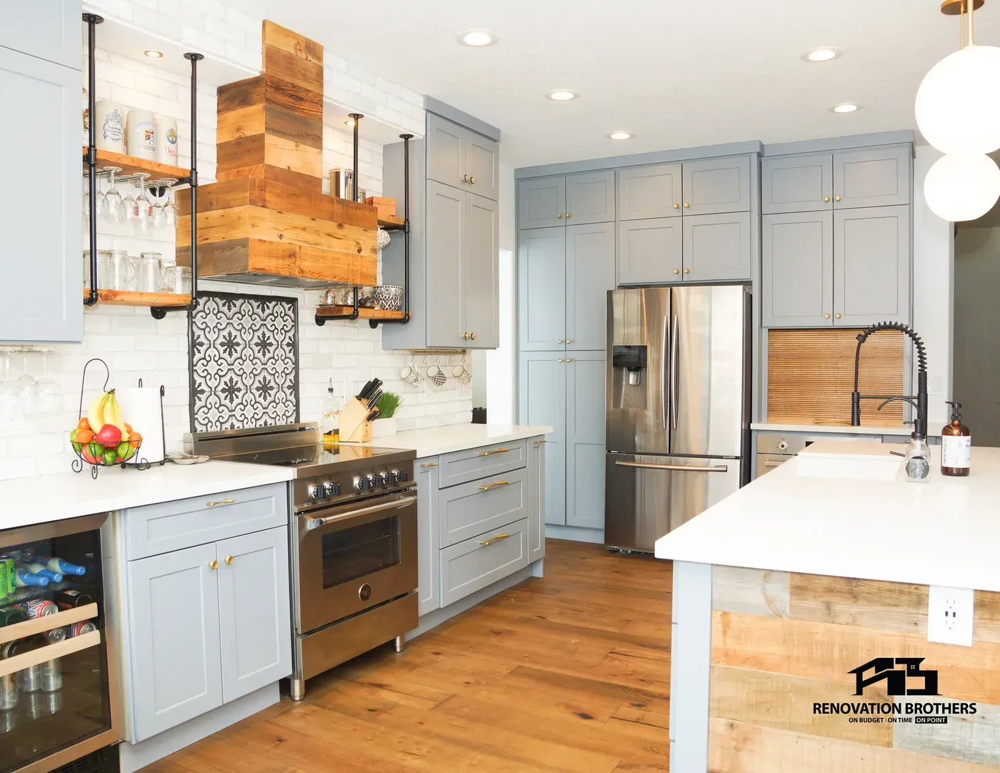 Wall-surround cabinetry with a built-in refrigerator set into the lower middle