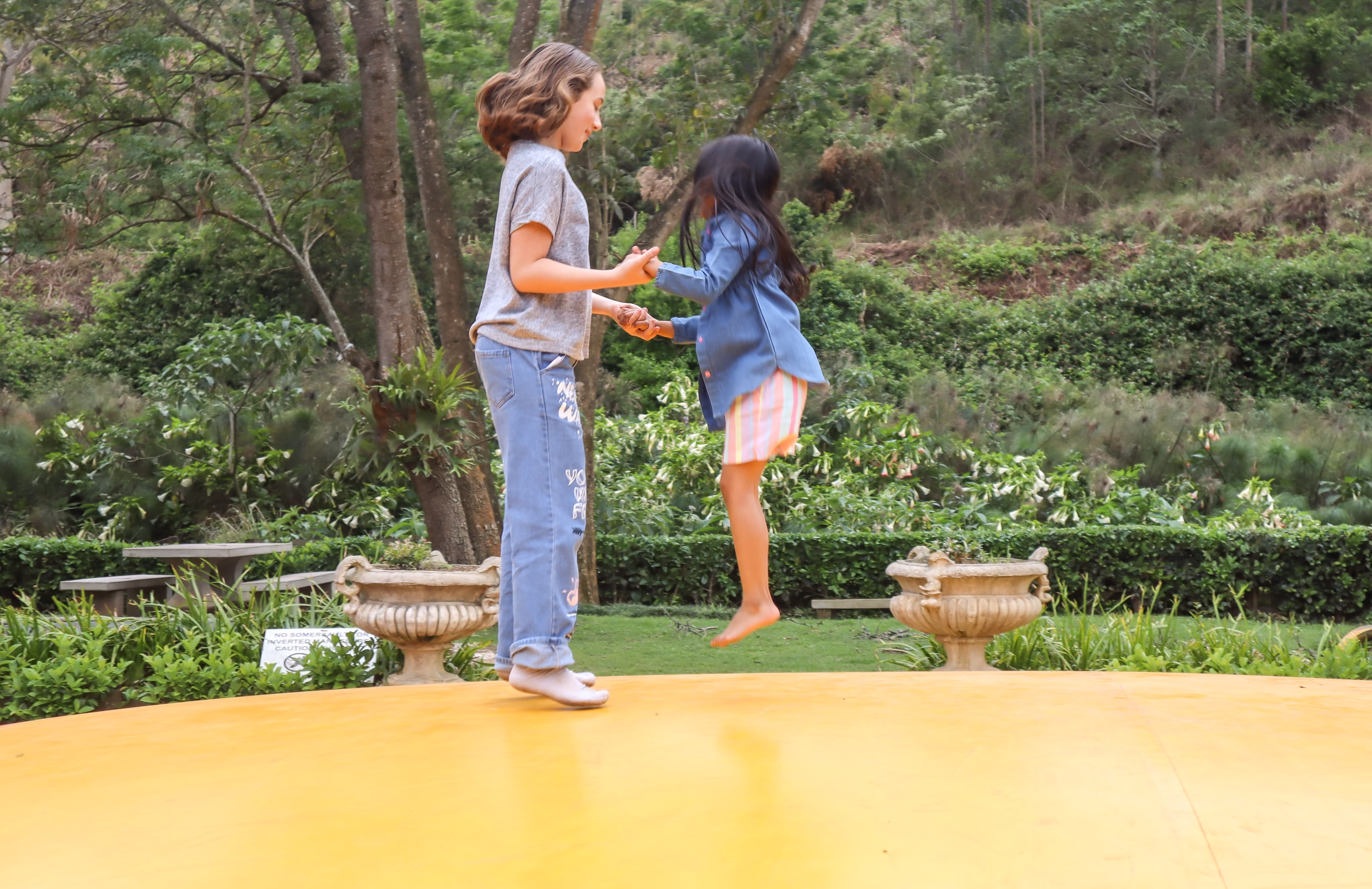2 Girls jumping together