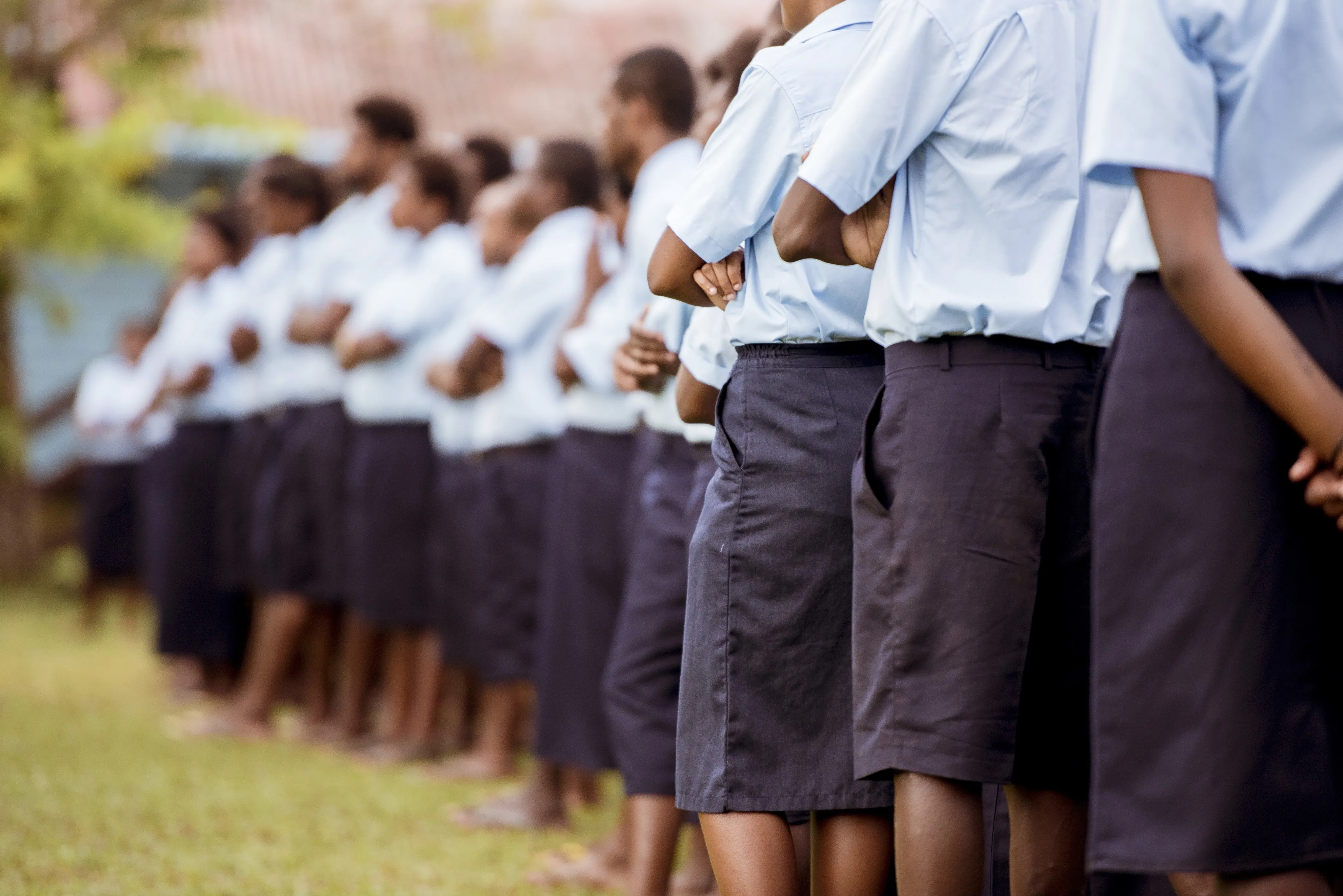 Group of kids standing together on a field