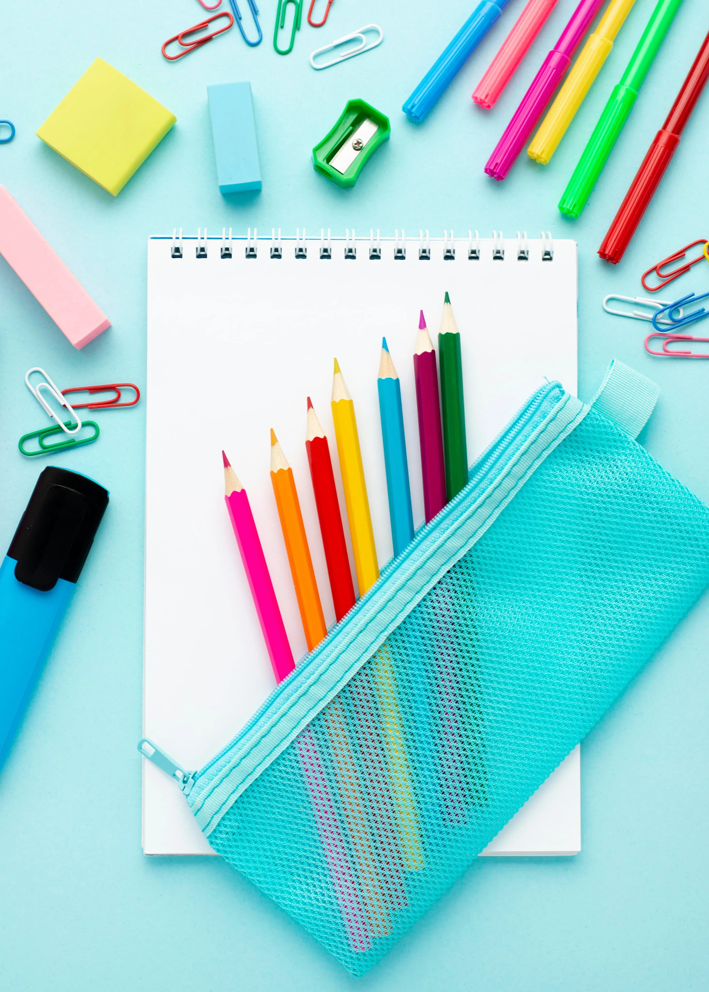 Paper and colourful pencils for drawing