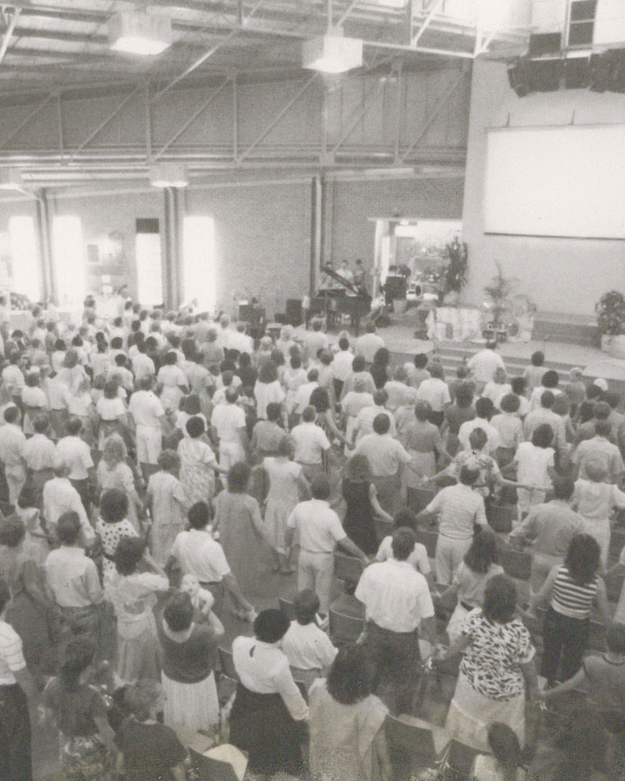 Old photo of a new covenant church bryanston church service in progress.