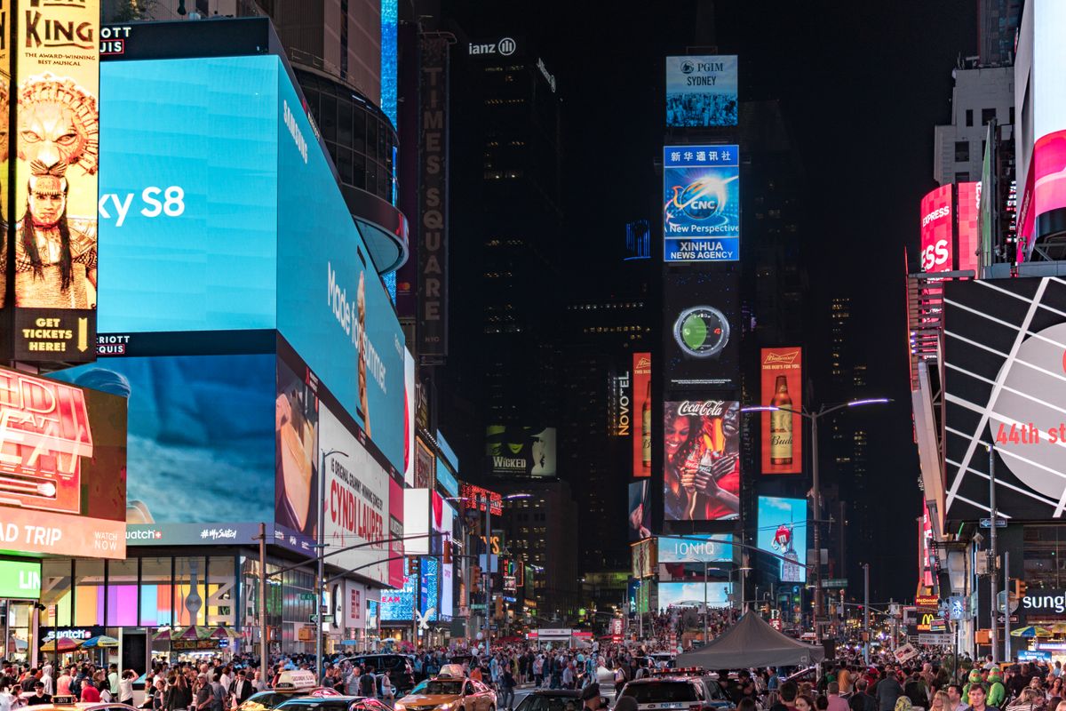 Illuminated Times Square billboards and digital advertising screens