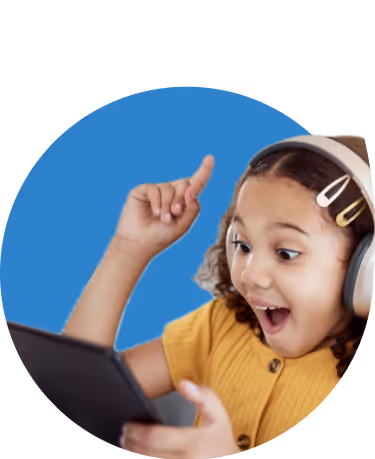 Excited young girl wearing headphones, pointing upward while looking at a tablet.