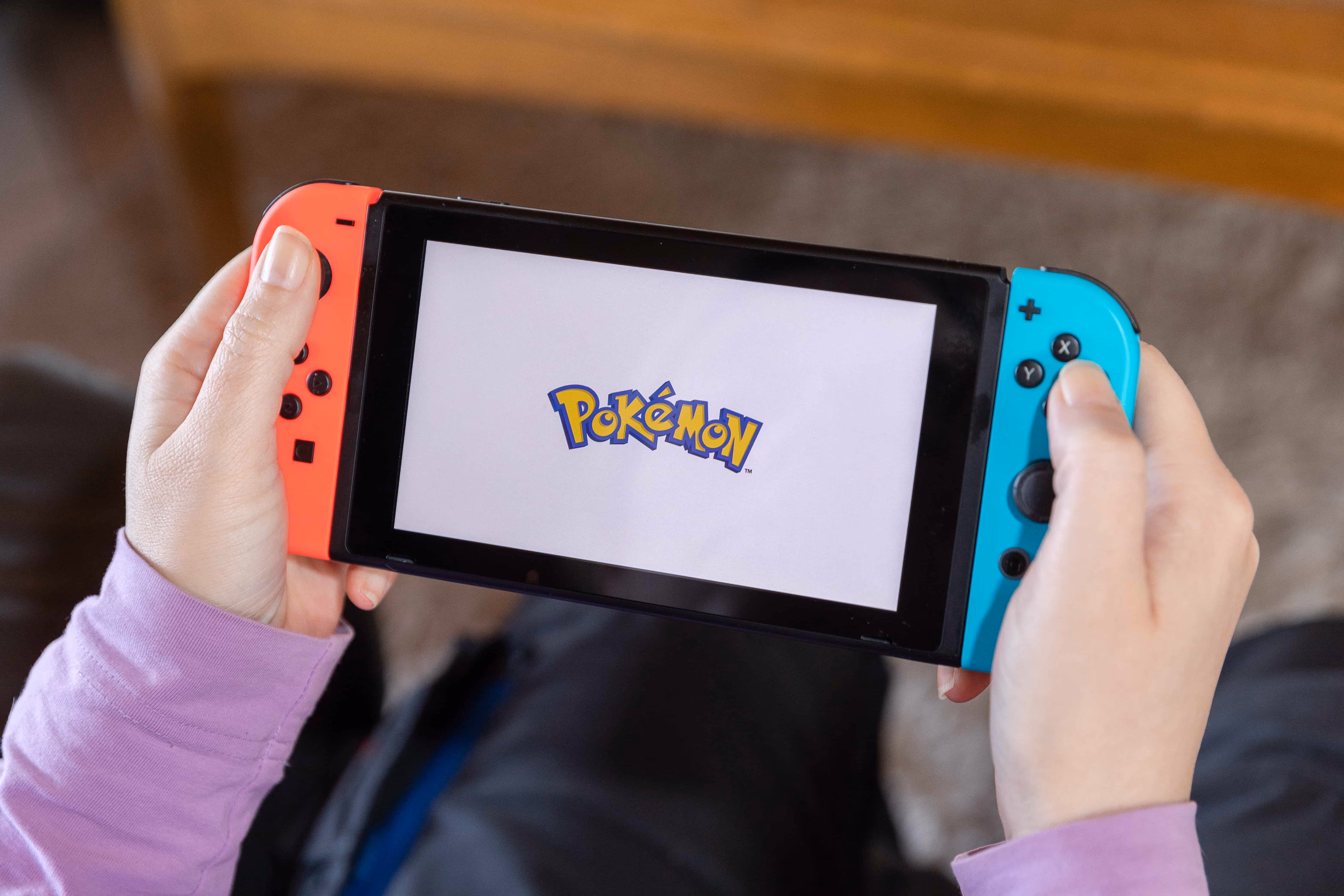 A person playing Pokémon on their Nintendo Switch.