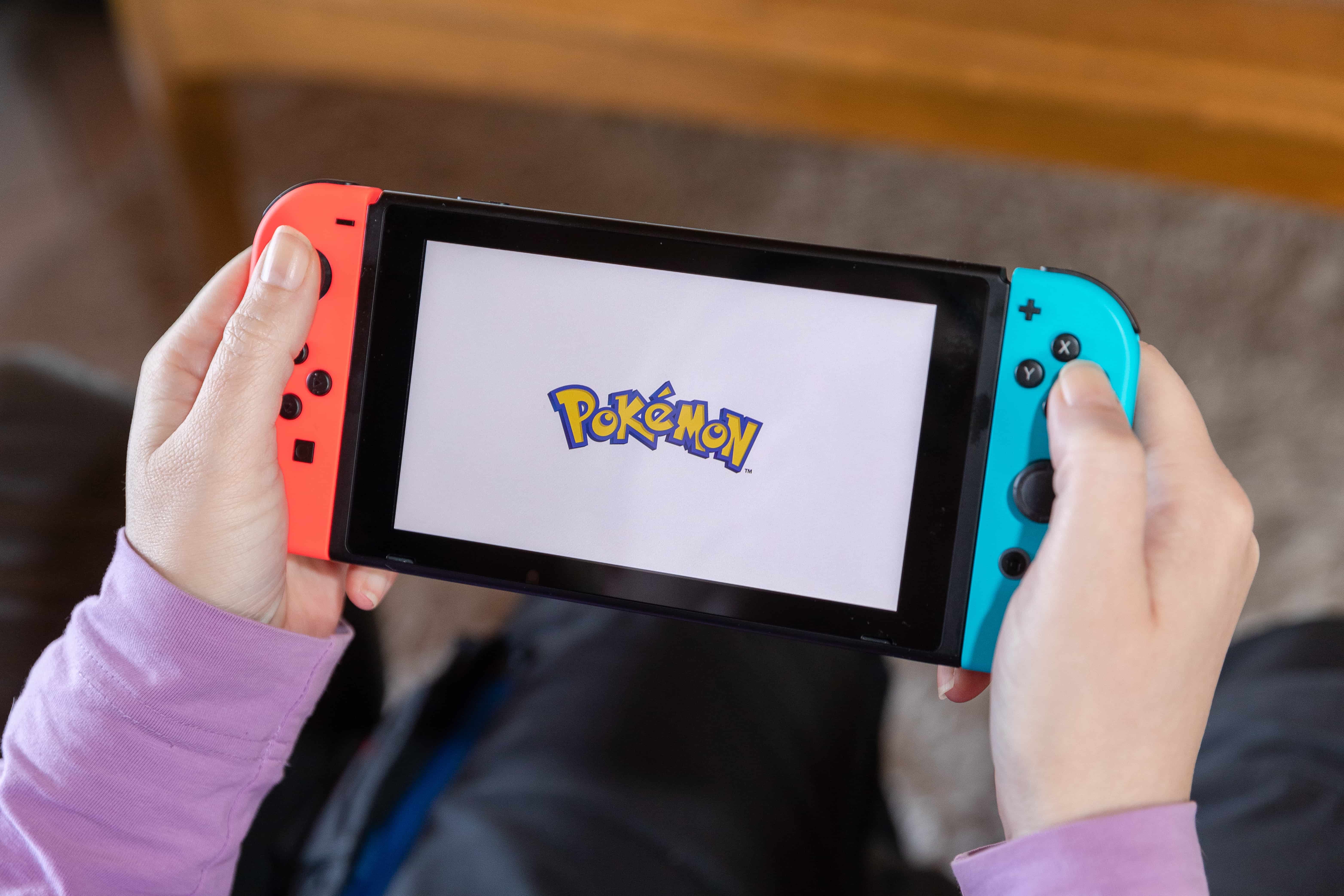 A person playing Pokémon on their Nintendo Switch.