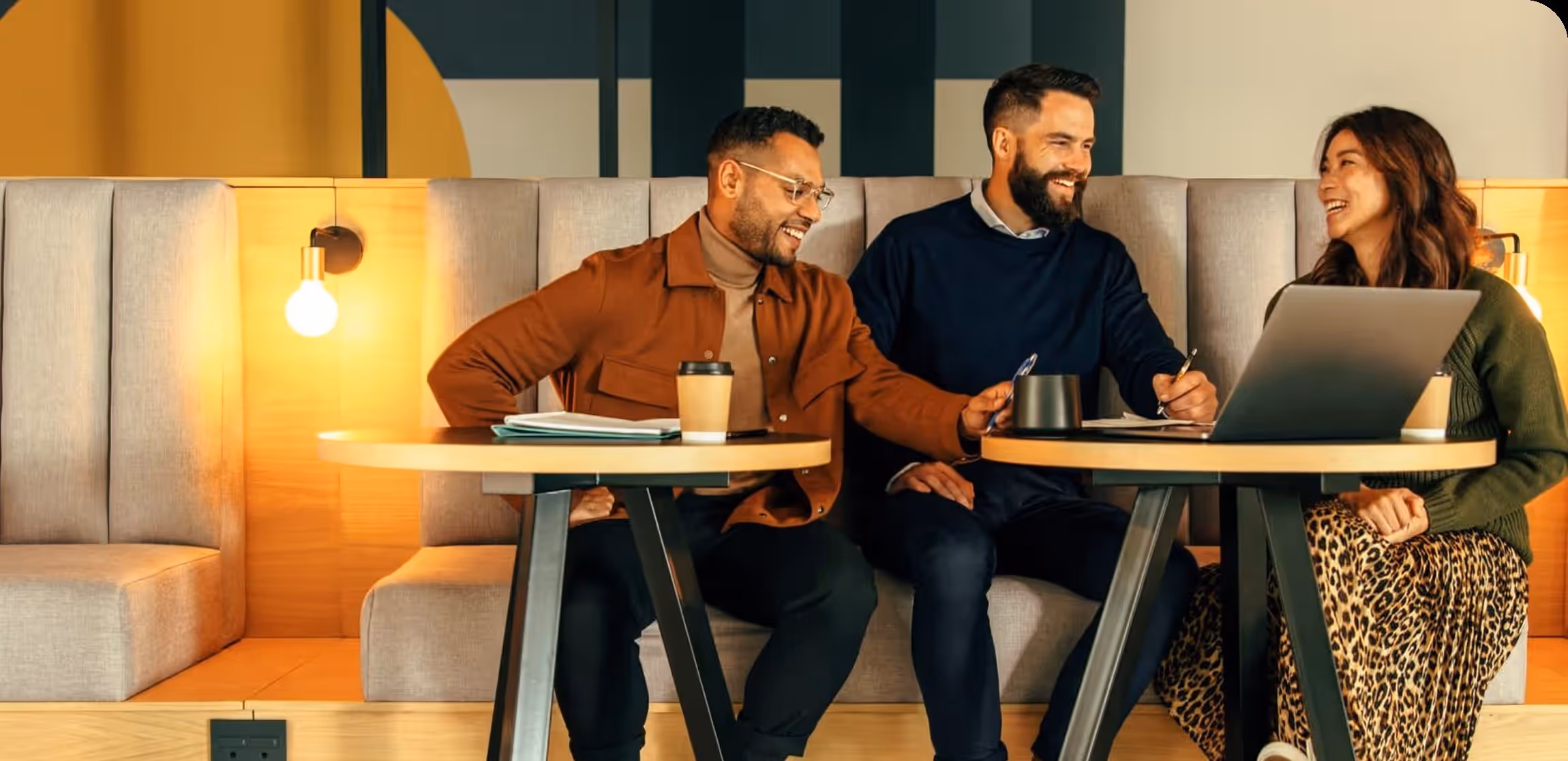 Two professionals collaborating in a flexible corporate training space available for rent