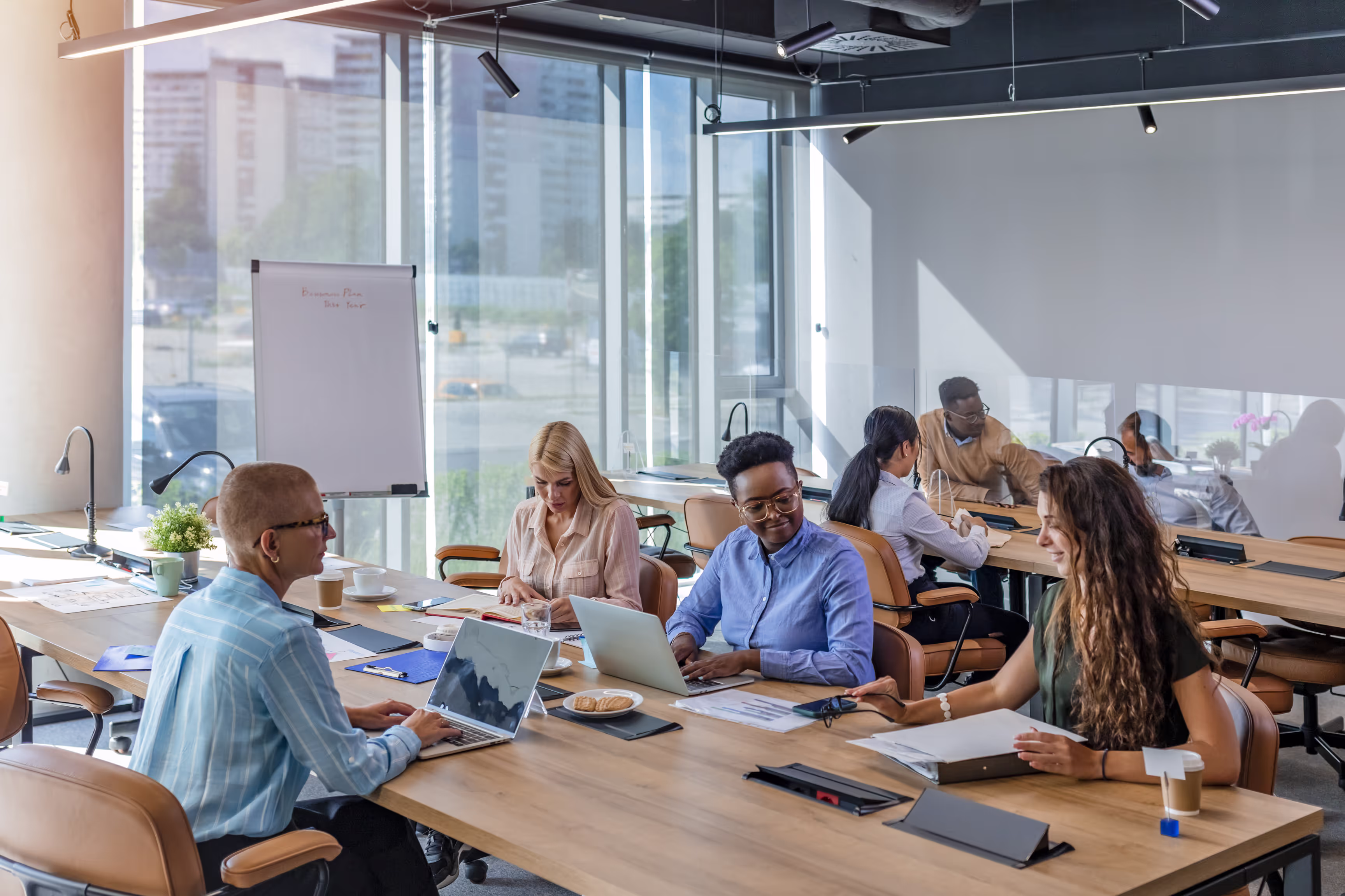 Modern coworking office space in Jersey City featuring open desks, private offices, and collaborative areas.
