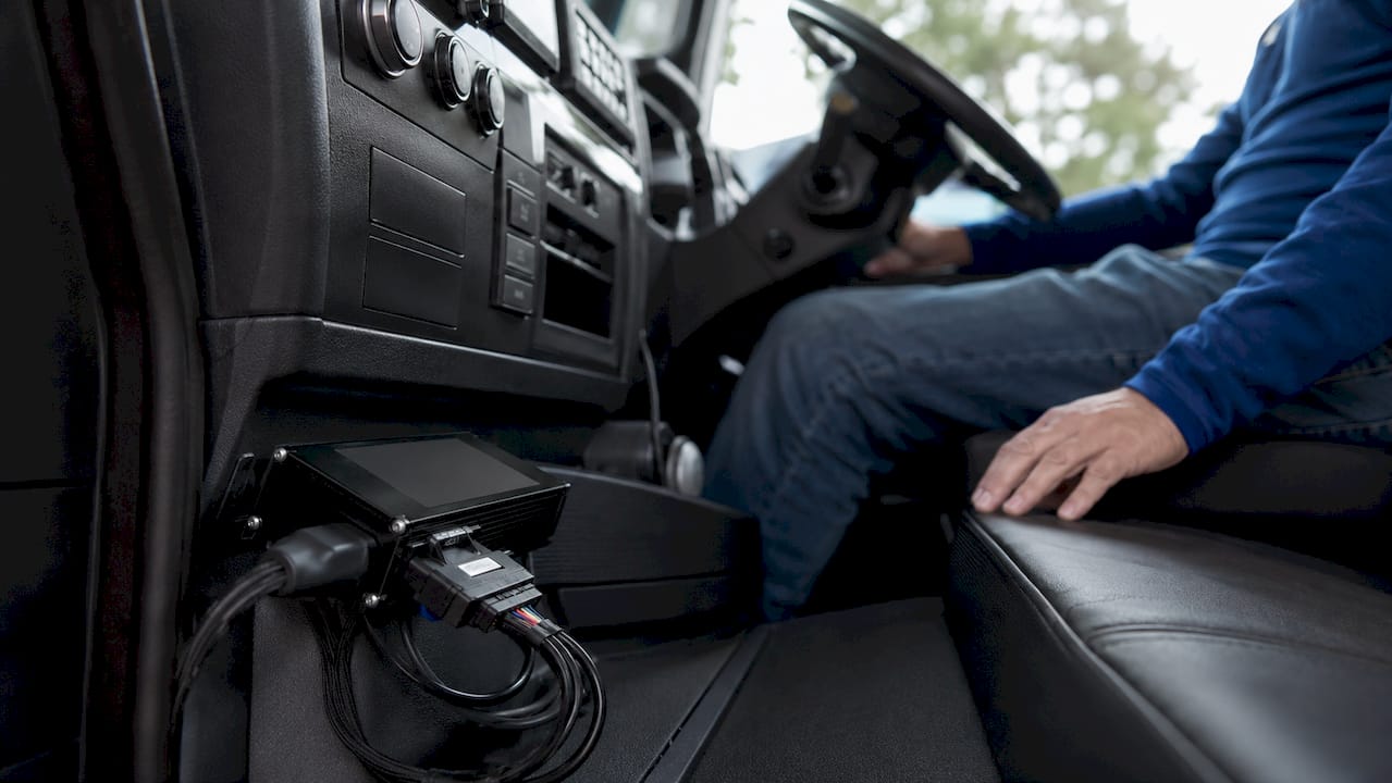 Telematics hardware mounted in truck cabin